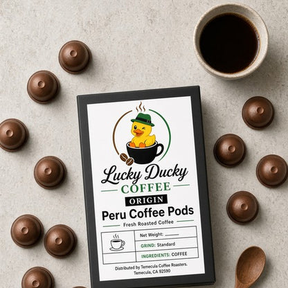 Overhead flat lay of Lucky Ducky Peru coffee pods and packaging