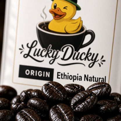 Close-up of Ethiopia Natural coffee beans and Lucky Ducky Coffee packaging